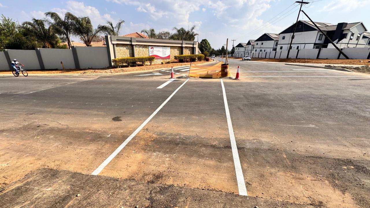 New lane markings on the completed Waterfall Manor road