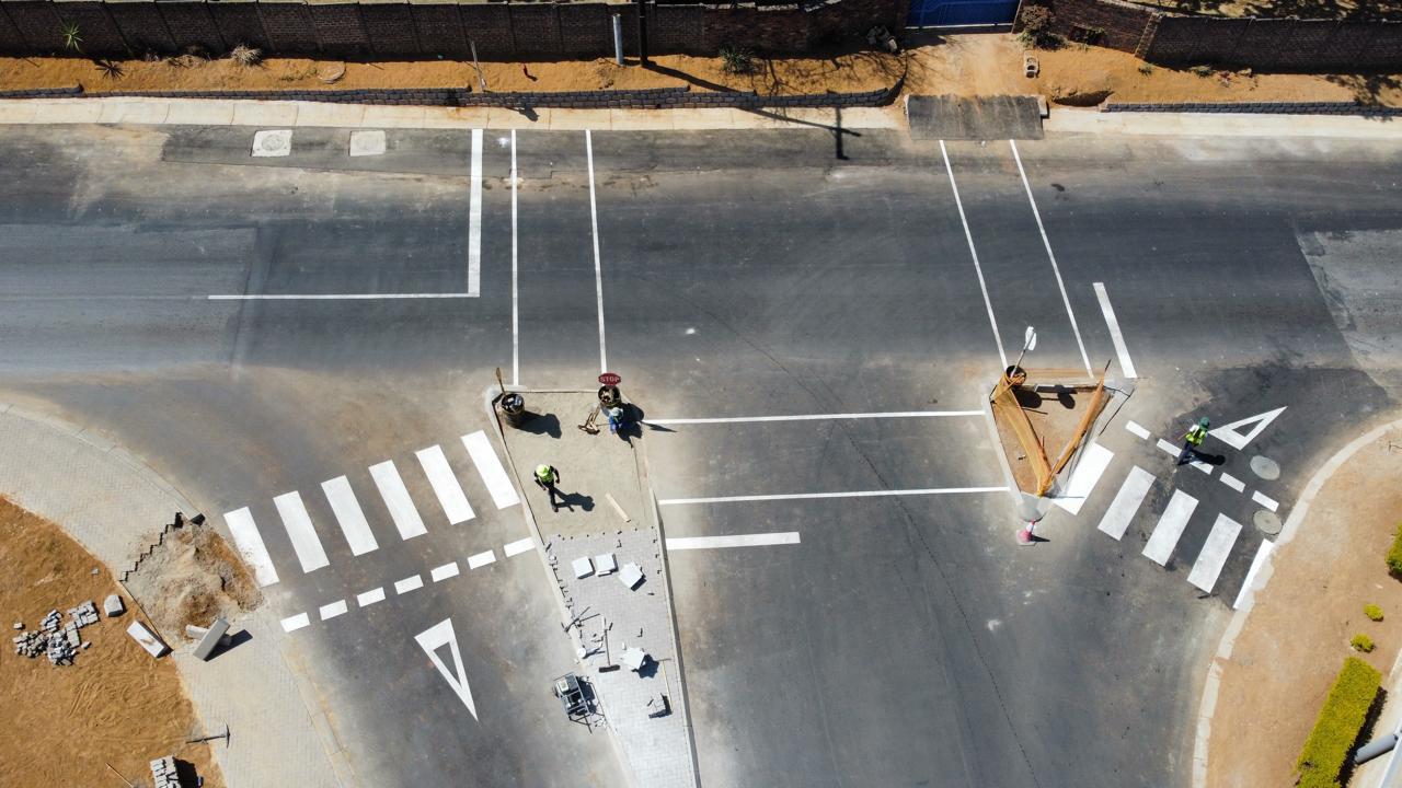 Aerial view of road marking crew completing the Waterfall Manor junction