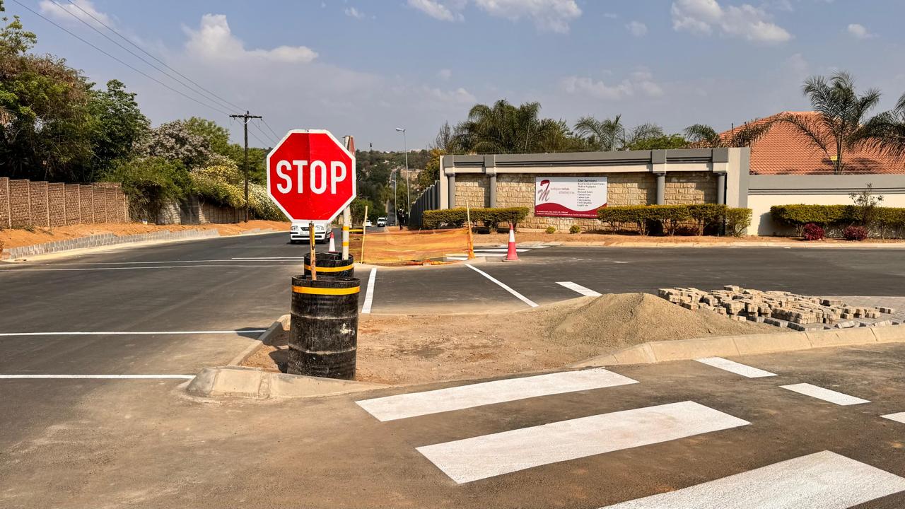 Stop control and crossing at the completed Waterfall Manor junction