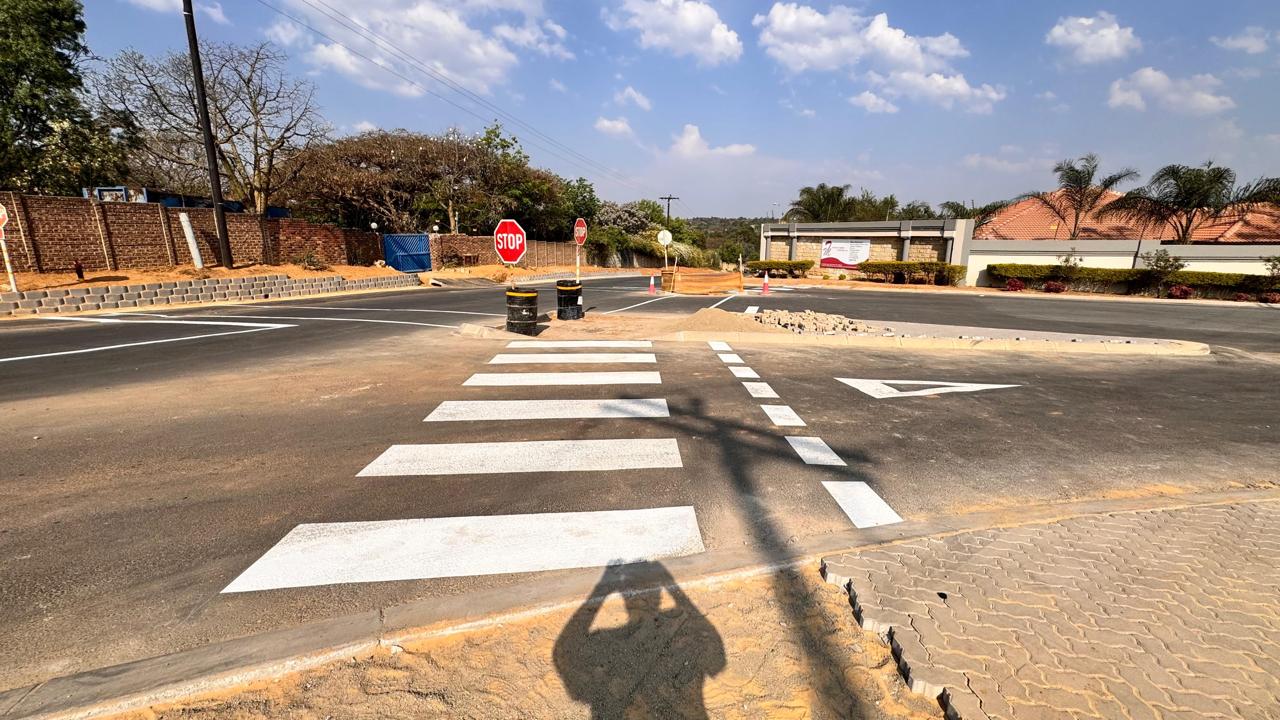 New pedestrian crossing and stop control at the completed intersection