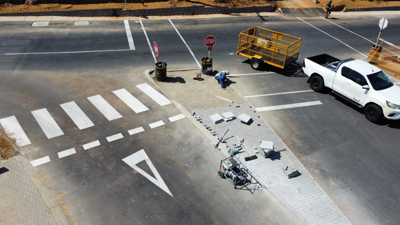 Aerial view of pedestrian crossing and paved island at Waterfall Manor